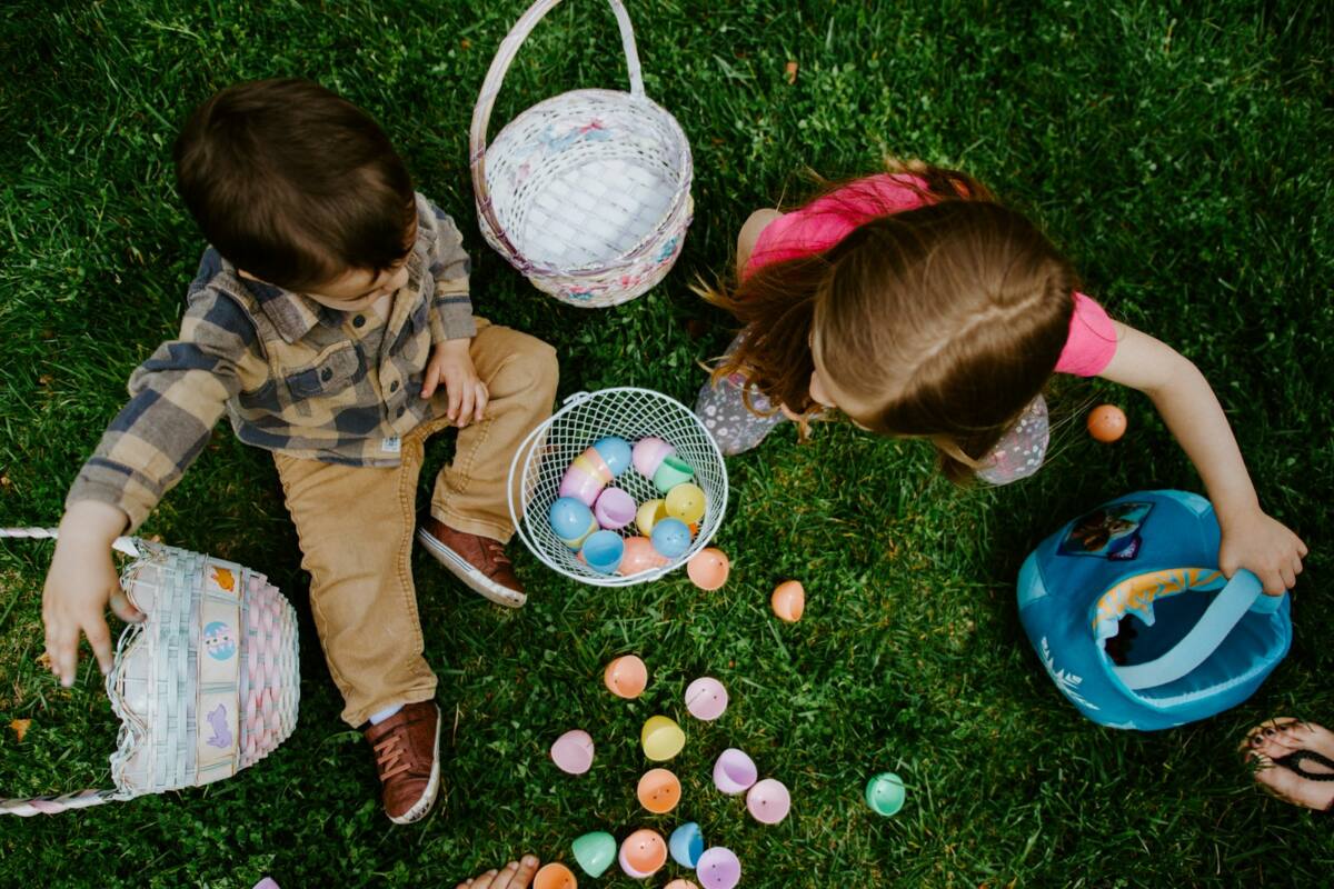 Easter basket phone case gift scene: kids with Easter baskets full of colorful eggs on grass
