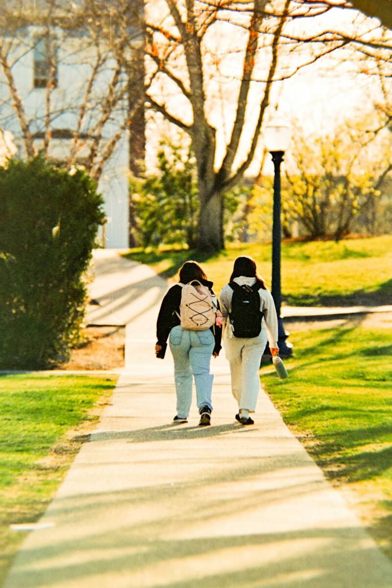 Matching phone cases for best friends: two friends walking on campus