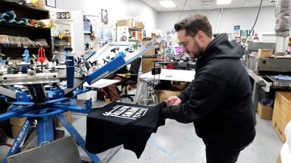 Close-up of print on demand equipment used to print each shirt individually to order