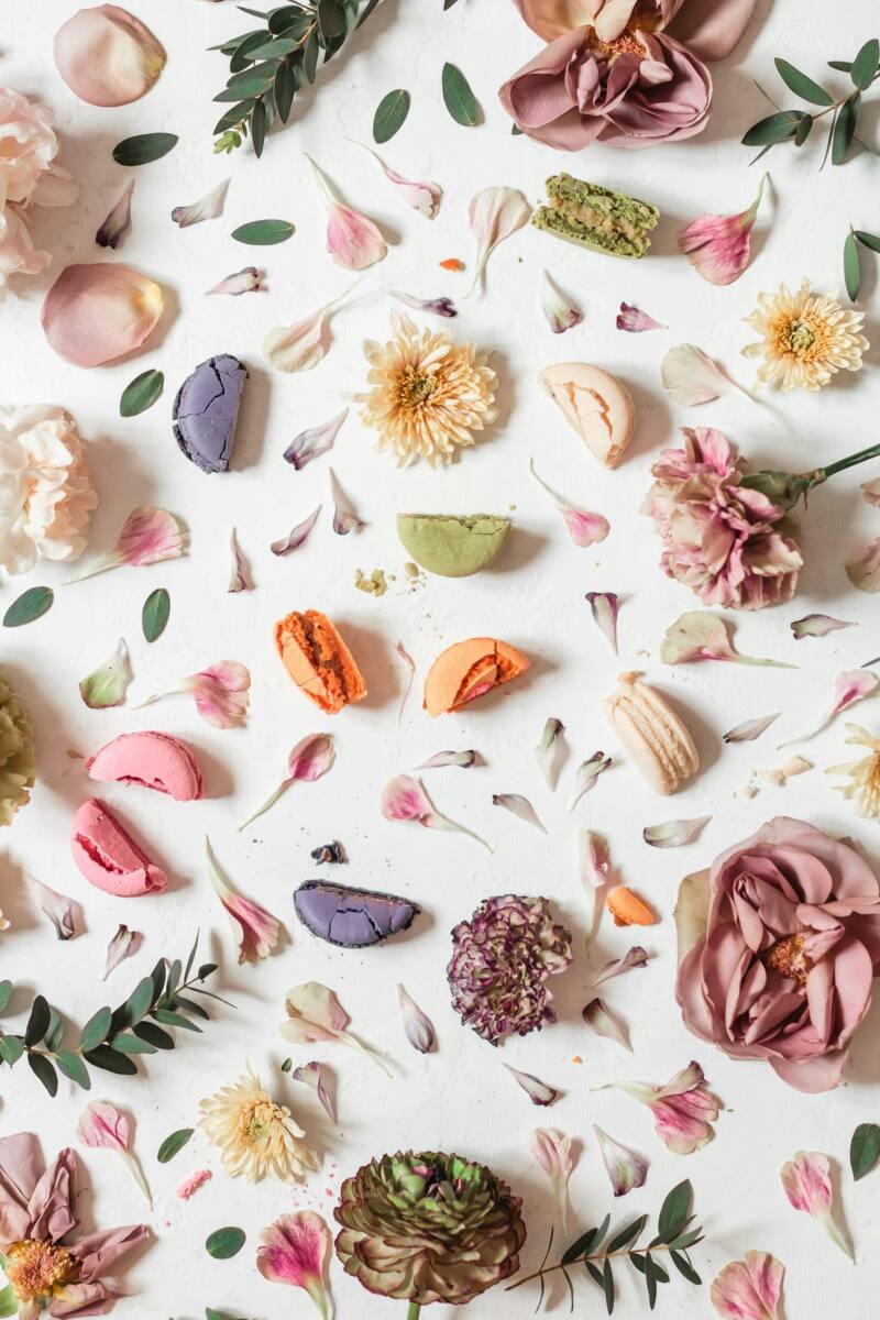 Pastel pink and white floral pattern with macarons, one of the best phone case ideas for mom