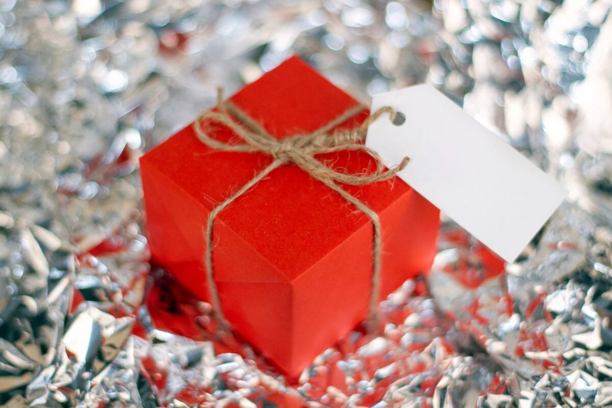 Last minute valentines day phone case gift scene: a small red gift box tied with twine