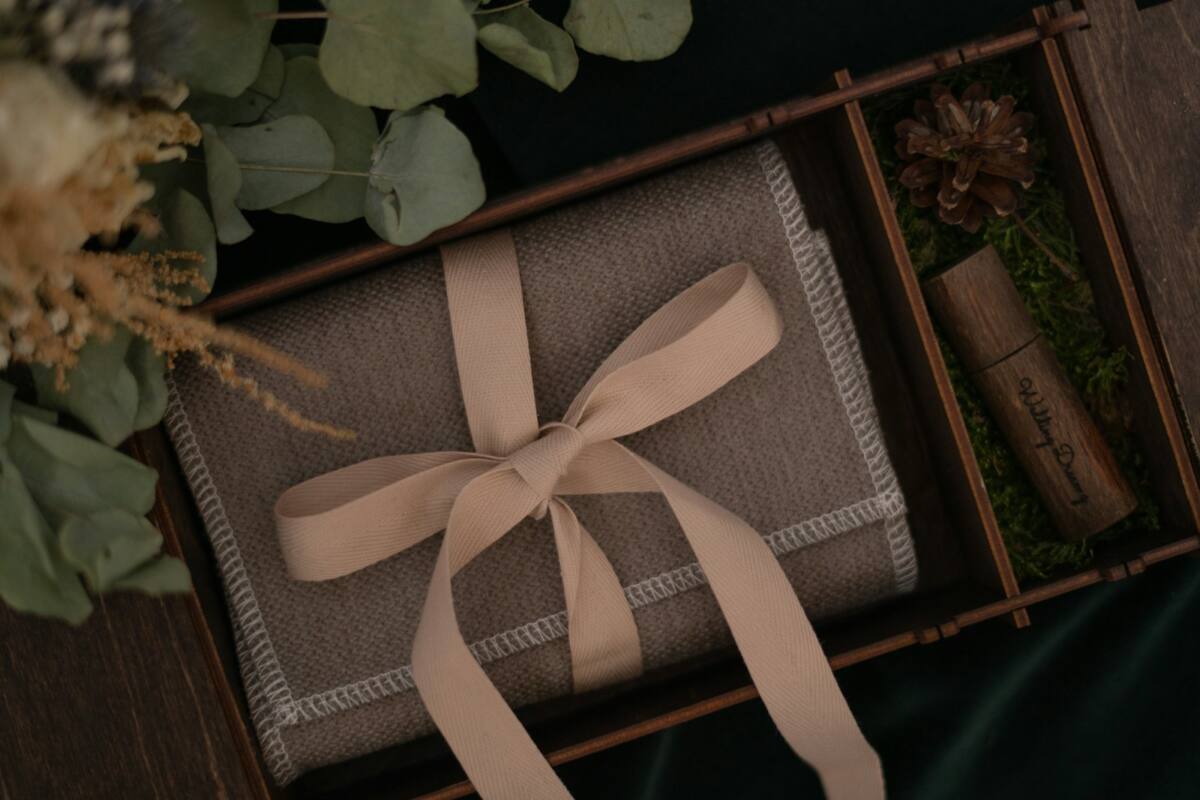 An elegant wrapped gift box styled as a wedding favor phone case gift
